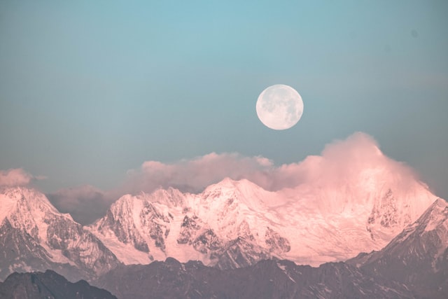 full moon over mountains pastel colour setting full moon ritual