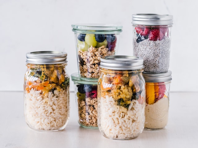 glass jars with different lunches and breakfasts meal prep sunday routine