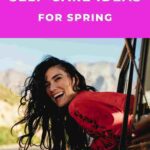 woman with black hair leaning out of driving car smiling into camera 12 self-care ideas for spring