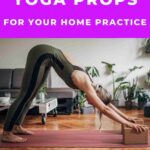 woman doing downward facing dog at home on yoga mat using yoga props 5 best yoga props for your home yoga practice