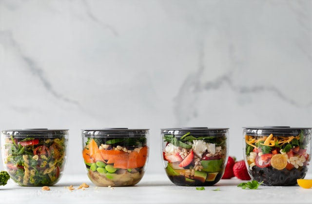 4 glass containers filled with food 10 healthy lifestyle habits for busy women meal prep