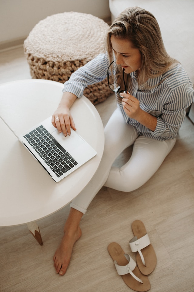the image is showing a woman sitting on the floor working from home the blog post is about the importance of core values in life