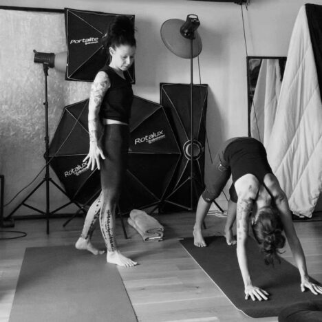 private yoga class at home yoga teacher and student downward facing dog