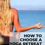 close up of woman with long blonde hair sitting in easy crossed leg position in front of ocean showing her back into camera how to choose a yoga retreat that is right for you