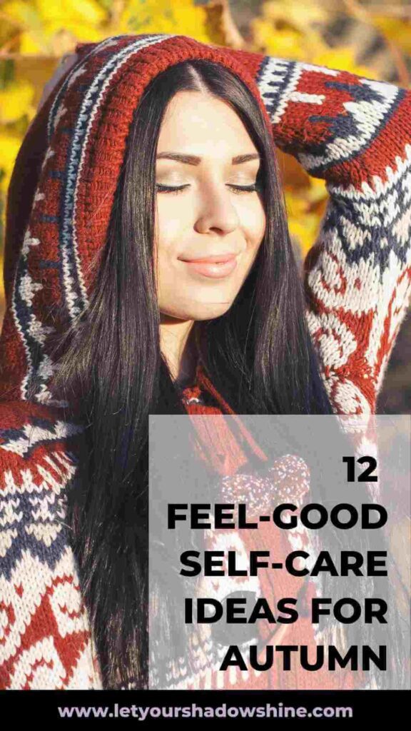 woman with dark long hair wearing knitted winter jumper enjoying the autumn sun 12 feel-good self-care ideas for autumn
