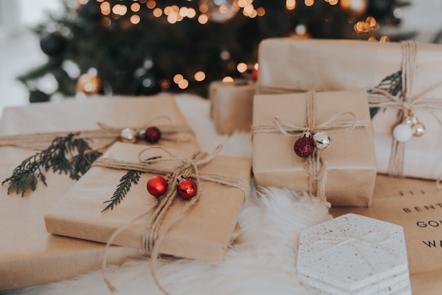 the picture shows beautifully wrapped Christmas presents and the blog post is about navigating the festive season and helpful self-care at Christmas ideas and tips