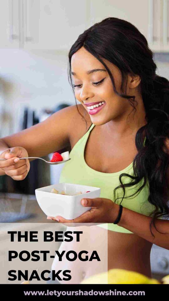 woman with long dark hair eating fresh fruits from a bowl post-yoga snacks