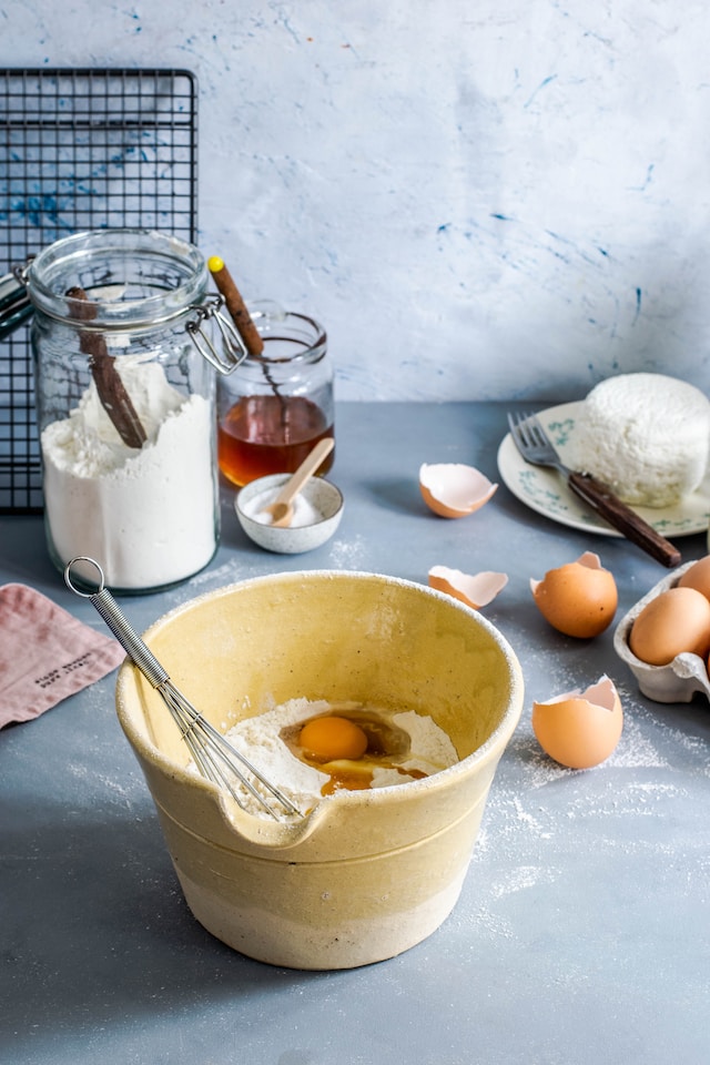 picture showing baking ingredients, flour, honey, eggs and a mixing bowl treat yourself ideas baking