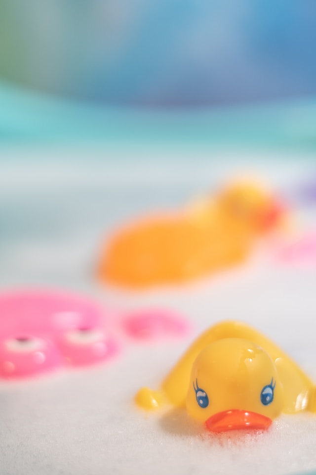 close up of bubble bath rubber duck ways to treat yourself ideas