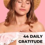 blonde woman with straw hat and closed eyes, both hands on her heart enjoying a moment of deep gratitude daily gratitude journal prompts