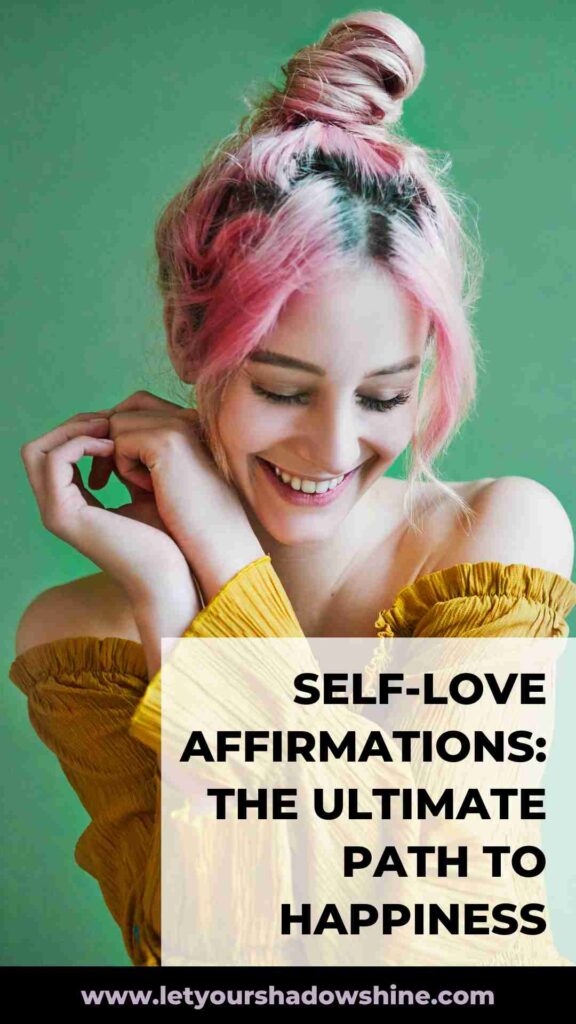 woman with pink hair wearing yellow top smiling and feeling happy from within self-love affirmations