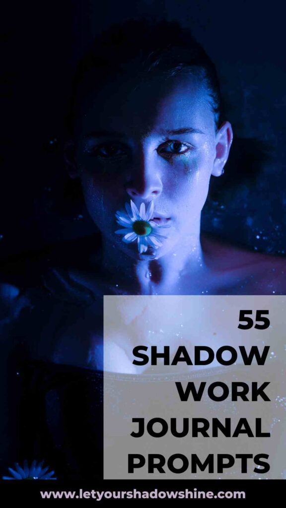image showing close up of woman's head and woman is holding a flower in front of her mouth picture is in dark colours dark blue and black shadow work journal prompts