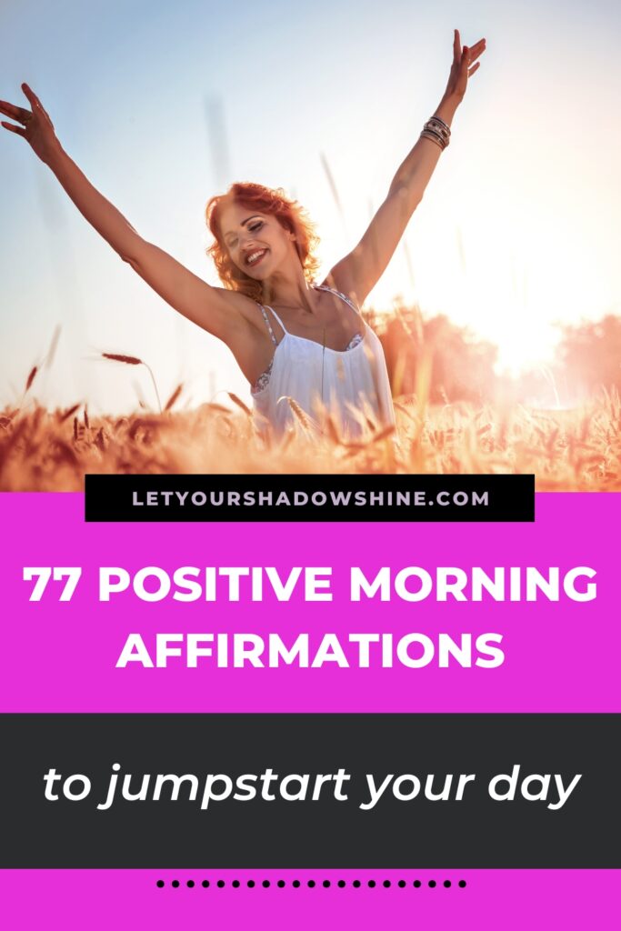 Pinterest pin image showing woman with red hair smiling into camera standing in a field blog post is about positive morning affirmations