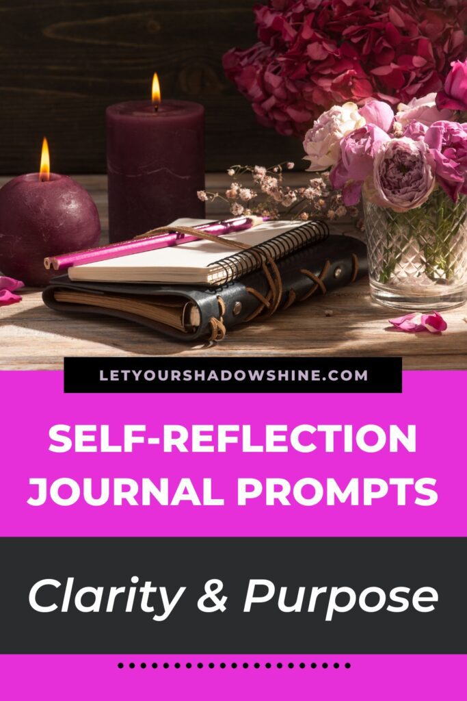 Pinterest pin image showing a close up of a journal sitting on a desk with a candle and dried flowers next to it the blog post is about self-reflection journal prompts