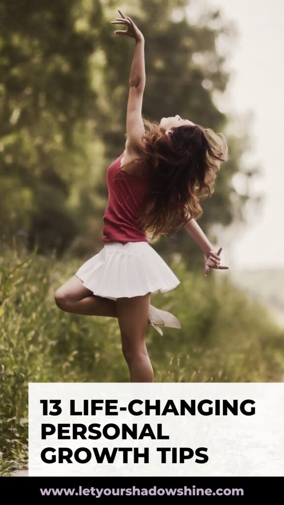 Pinterest pin image shows a woman in a nature setting the woman is dancing and one can feel happiness from that image the blog post is about personal growth tips