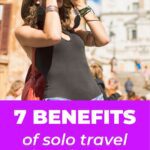 Pinterest pin image showing a woman taking pictures in a city she is visiting blog post is about benefits of solo travel