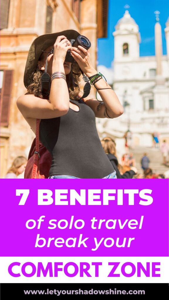 Pinterest pin image showing a woman taking pictures in a city she is visiting blog post is about benefits of solo travel