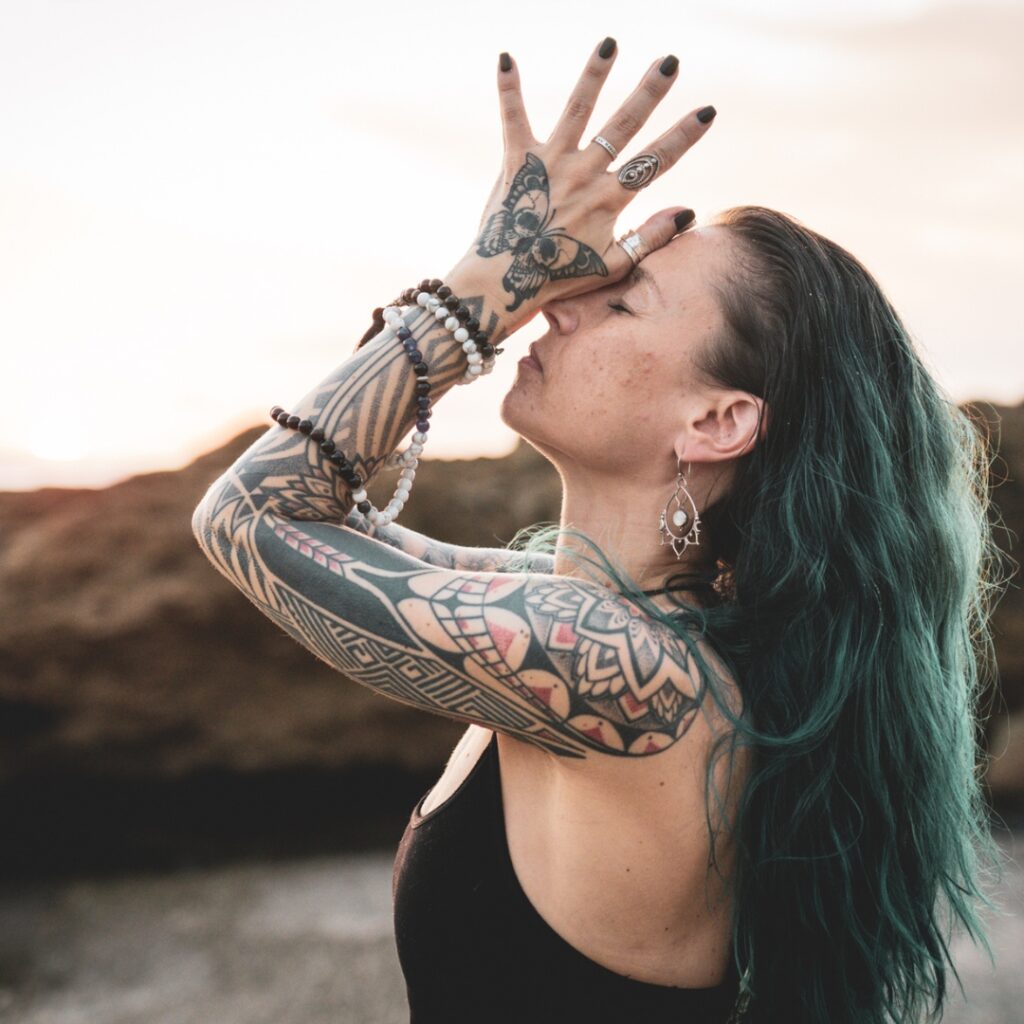 image shows a close up of nicolle spohn a certified yoga teacher at the beach and the image promotes her free 3 day morning yoga challenge