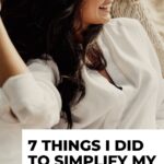 Pinterest pin shows a woman sitting in a comfortable arm chair smiling and feeling content the blog post is about powerful tips to simplify life